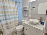 guest bathroom with shower/tub combo